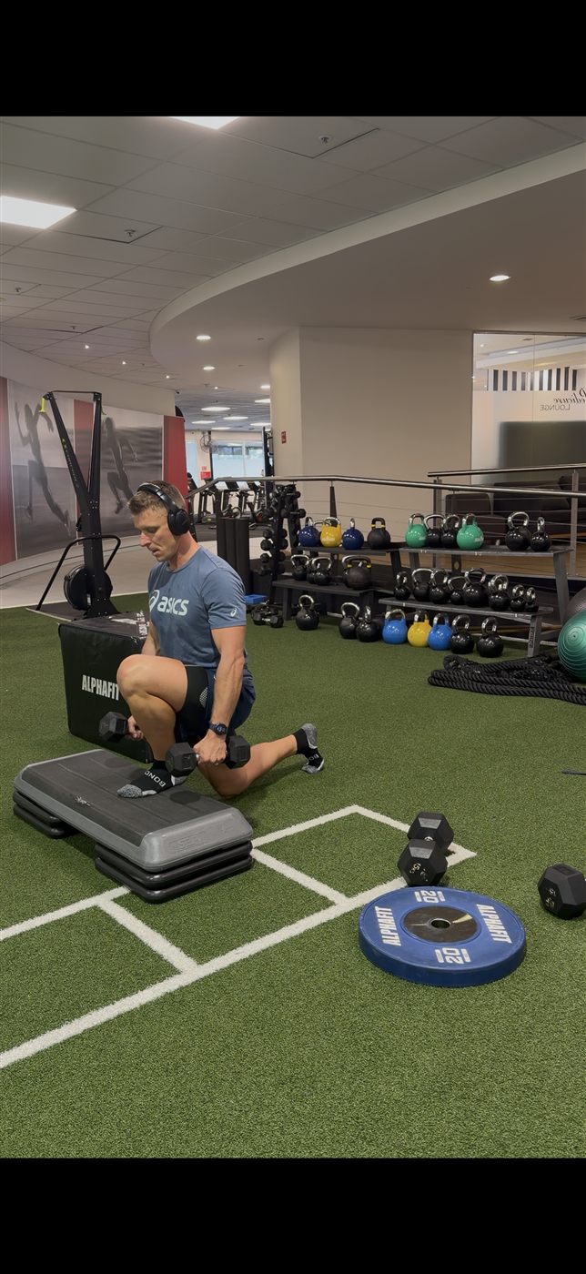 Nathan coaching a client through a lunge