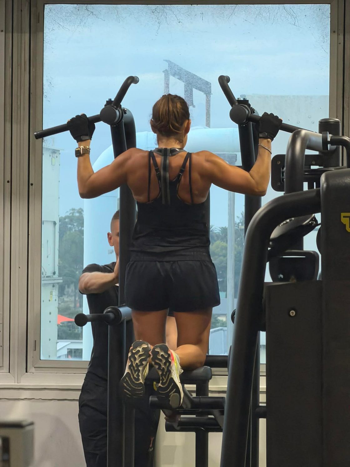 Rosie doing assisted pull-ups