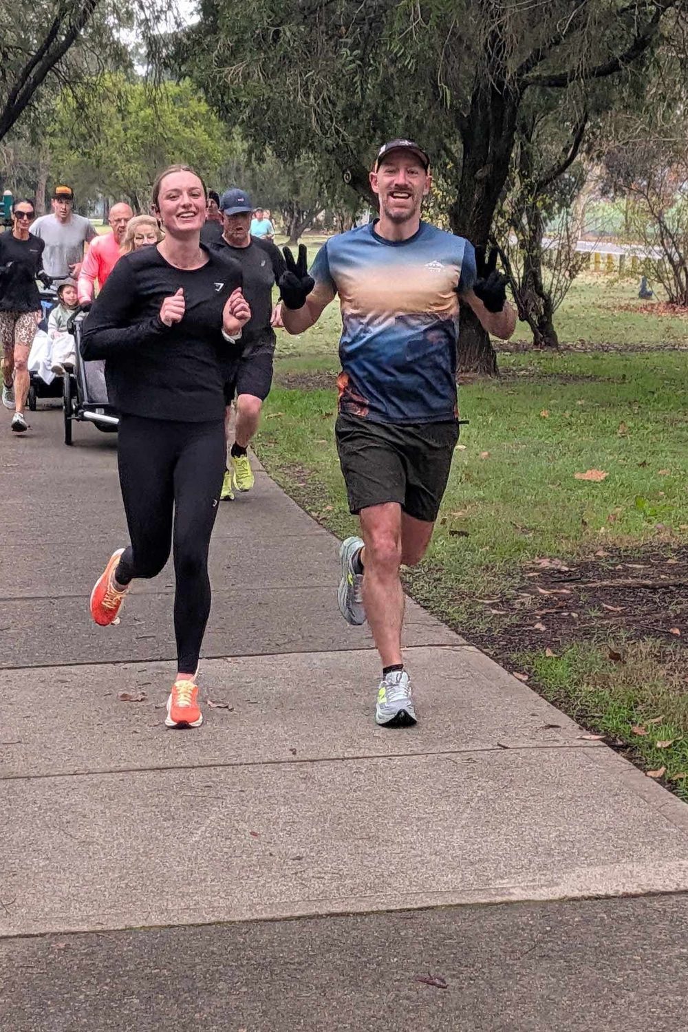 Chloe running with coach Nathan Morris