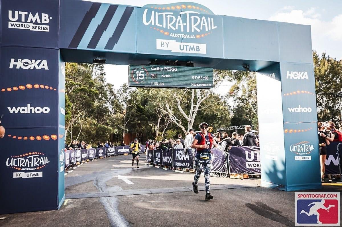 Cathy Perri crossing the finish line at Ultra Trail Australia UTA50 in the Blue Mountains