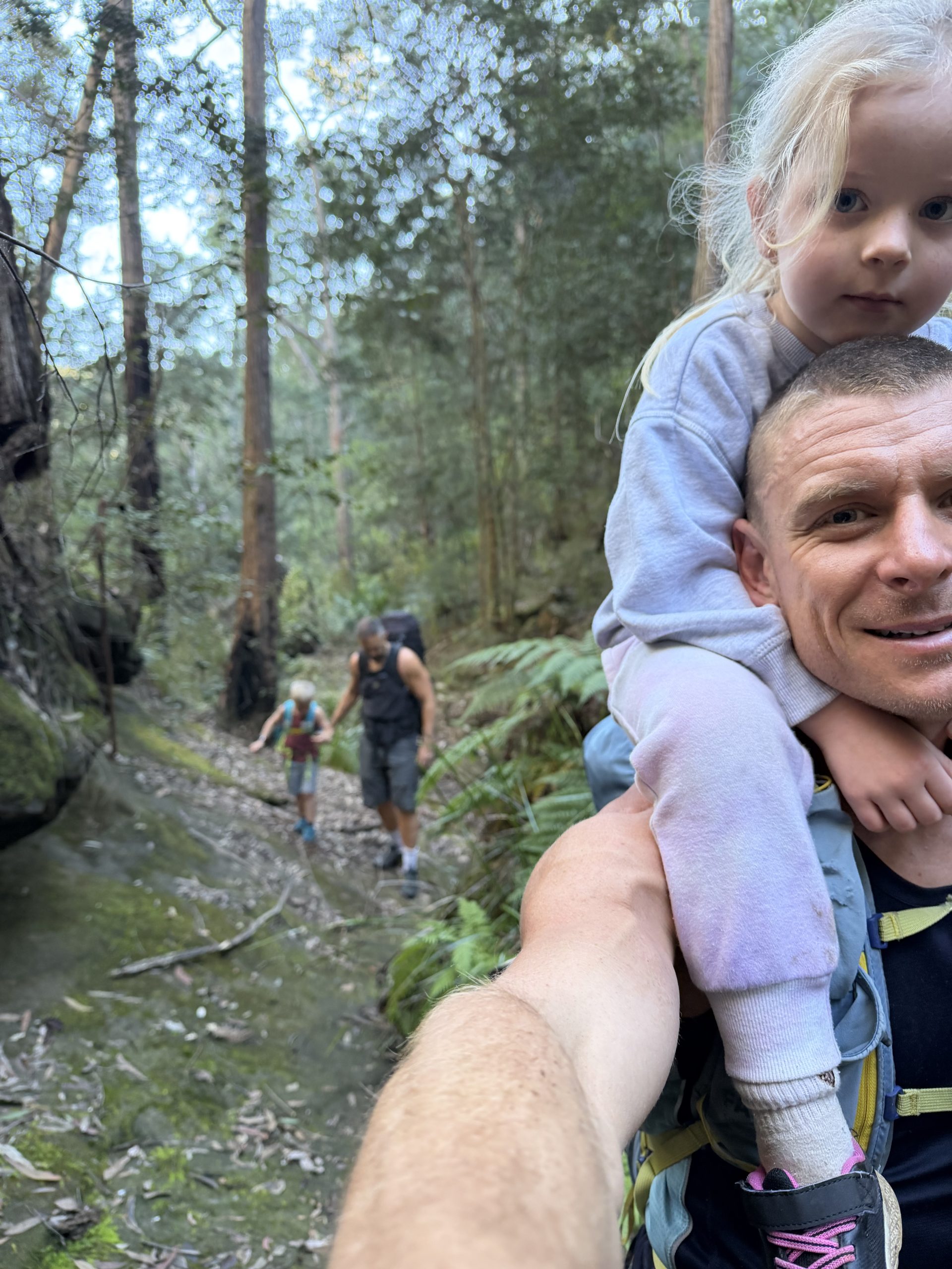Carrying one of the little ones on the trail
